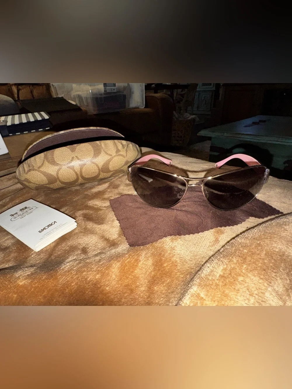 Coach aviator sunglasses with brown lenses and pink temples